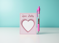 Love Notes Mini Notepad with pink pen on white table